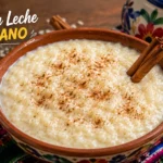 Authentic Bolivian arroz con leche served in a traditional clay bowl with cinnamon and colorful Andean textile, representing the best arroz con leche boliviano near me.